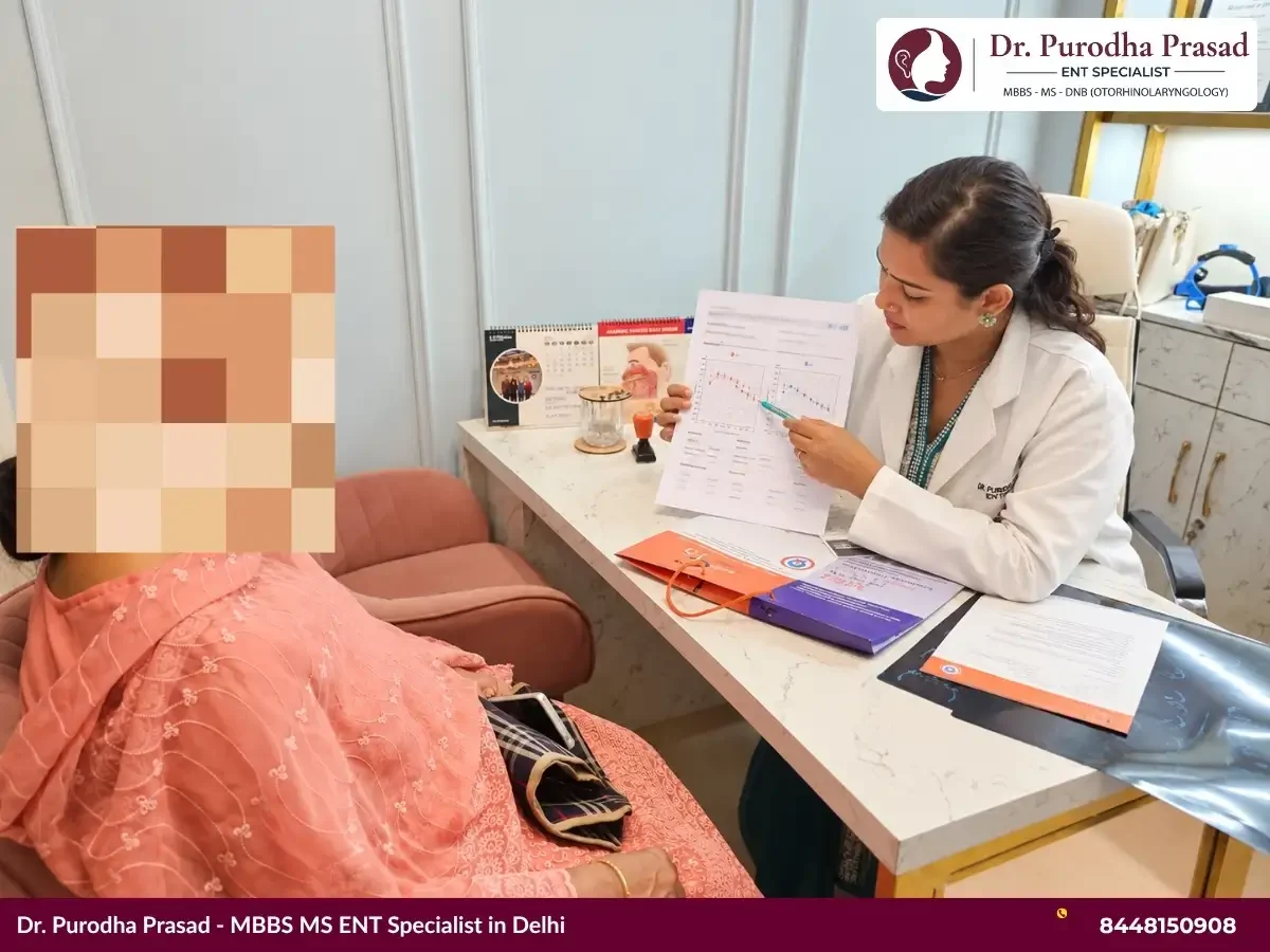 Dr. Purodha explaining Audiometry results to an elderly female patient in Delhi.