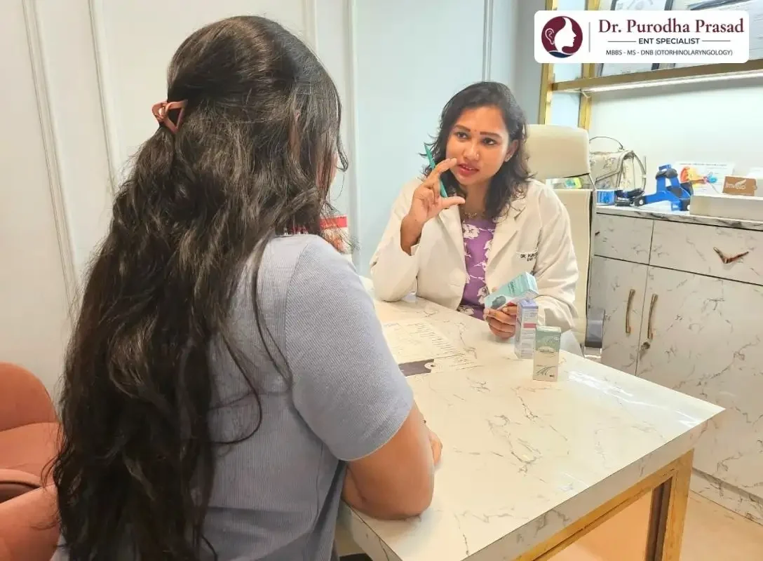 Dr. Purodha Prasad explaining Medicine usage to patient at her ENT clinic in South Delhi.