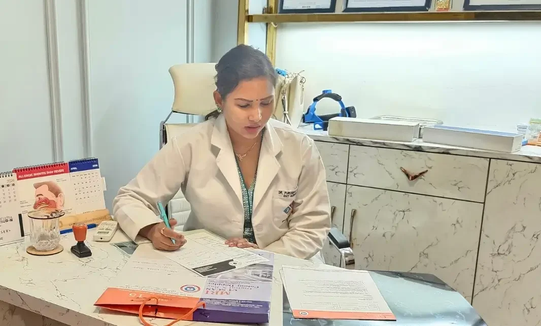 Dr. Purodha Prasad prescribing medicines for hearing loss in Delhi.